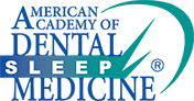 The image shows a logo with text that reads  ALABAMA DENTAL SLEEP MEDICINE  on top of a stylized graphic resembling a sleep mask, which is placed over a blue background with white and green accents.