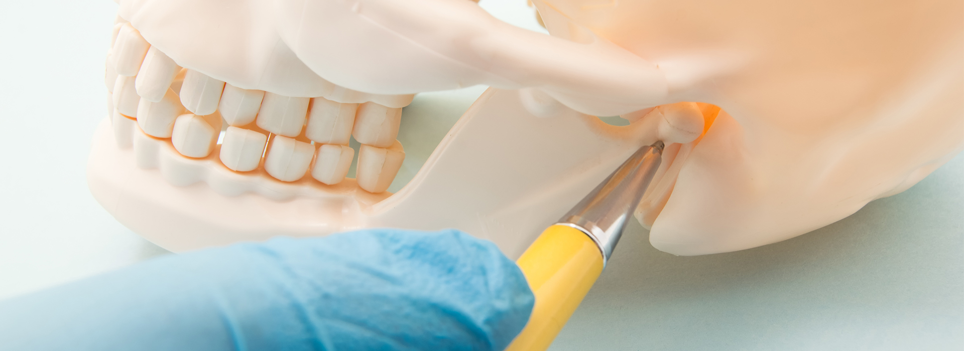 A dental implant being prepared with a small drill.